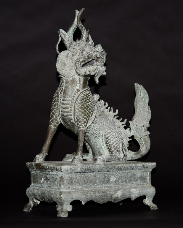 Chinese Ming Bronze Kirin Form Scholar Incense Bur: 16/17th cen, Chinese Ming burner with rich outdoor green patina. Head turning upward on an altar form base. Opening on the side of the base to allow air flow into, burning incense in a separate bronze