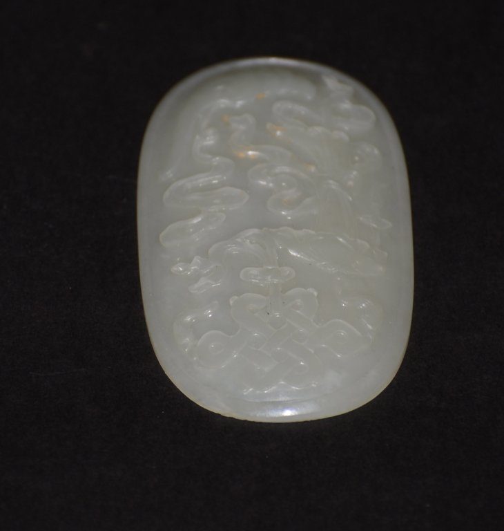 Chinese jade Oval Plaque: 19th cen Chinese jade oval plaque of precious objects, Qing period. Measures4"l by 2.25"w