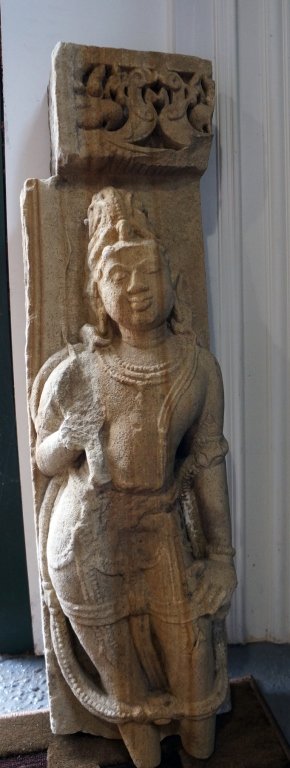Indian Stone Buddha Fragment: Indian stone buddha fragment of very early age, possibly pillar ornament on side of a door. Measures 28"h, 7.5"w