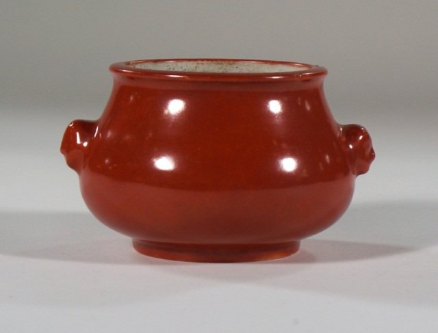 Chinese Coral Red porcelain Censer: 18/19th cen Chinese coral red porcelain censer with two foolion mask on each side, measures 4"dia 3"h