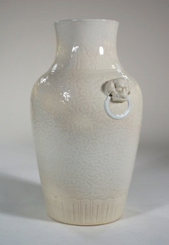 Chinese White Porcelain Vase: soft paste, foolion mask on each side. Measures 11"h 8" dia