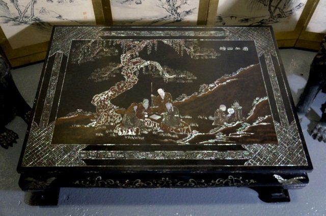 Chinese Mother-of-Pearl Inlay Lacquer Table: Chinese mother-of-pearl inlay lacquer table, scholar playing go with boy brewing tea at side scene. Qing period, 19th cen, measures 14.5"h, 45"w, 32"l