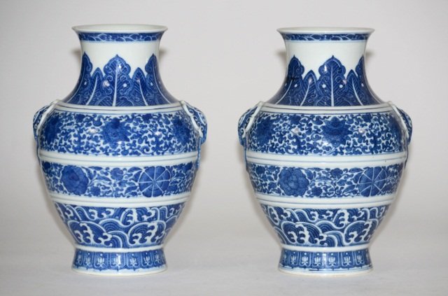 Pair Chinese Blue White Porcelain Vases: Pair of Chinese blue white porcelain vases of Buddhist lotus motif, beast mask handle with palm leaf motif on the shoulder, drilled, 19th cen, measures 10.25"h. Provenance: From a New England Gentlema