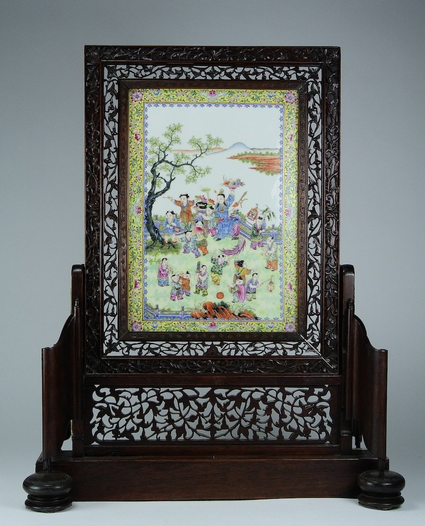 Chinese Republic Porcelain Plaque Table Screen: scene of children playing, early 20th cen, rosewood stand. Measures 23" by 16" overall, plaque measures 8.5" by 12.5" Please visit our website http://stallionhillgallery.com/ to see the high resolutio