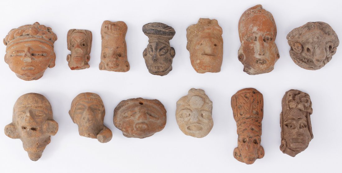 Collection of 13 Terracotta Pre Columbian Pottery Heads: Lot of 13 assorted spiritual and religious Terracotta pottery fragments Sizes - measurements 1 1/4" to 2 1/2" (3.17cm x 6.35cm)