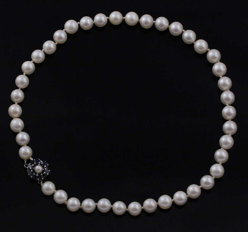 High Luster Pearl Necklaces Sapphire 14K Clasp: White High Luster Cultured Pearl necklaces one choker length with 14K clasp set with Sapphires Size - 14 1/2" length 7.5mm pearls