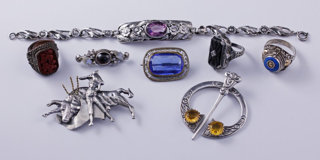 Lot of Sterling Silver Jewelry Celtic Poison Ring: Collection of assorted Sterling Silver antique jewelry including Cinnibar ring set in wirework, Mexican bullfighting pin marked MR, Victorian blue glass in wirework setting, Celtic Kilt pin Birmingham