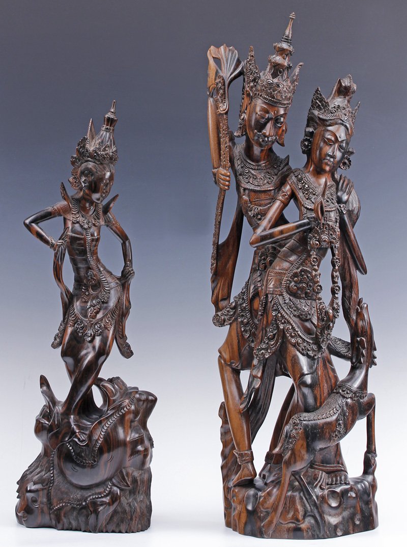 Pair Signed Sutawijaya Indonesian Wood Sculptures: Pair of vintage signed South Asian Indonesian wood carvings, signed "Godwisniy AA Sutawijaya" on base, elaborately carved with finely detailed costumes and stylized, elongated figures and animal (Drag