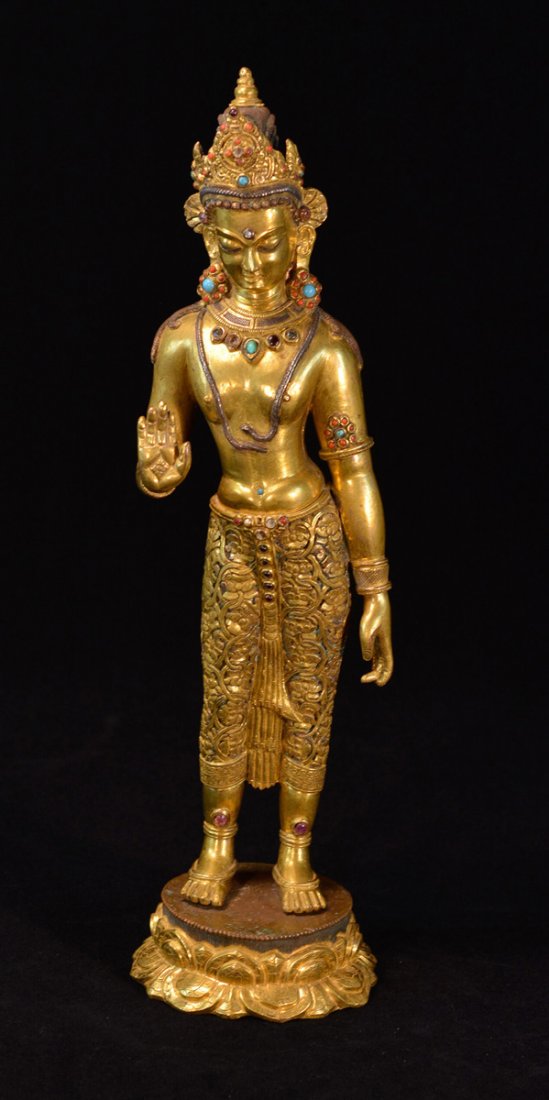 Nepalese Gilt Bronze Standing Buddha: 19/20th cen, measures 16.5"h. Jewel inserts.