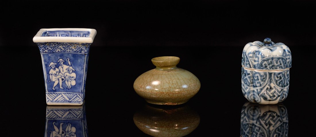 Group of Three Asian Porcelain Articles: including celadon small vase, blue white covered box, blue white cup, measures 3"h 6"w, 3"h 2.5"w and 2.27"h 2"w Provenance: Estate of Alfred Guntermann, New Haven, Ct