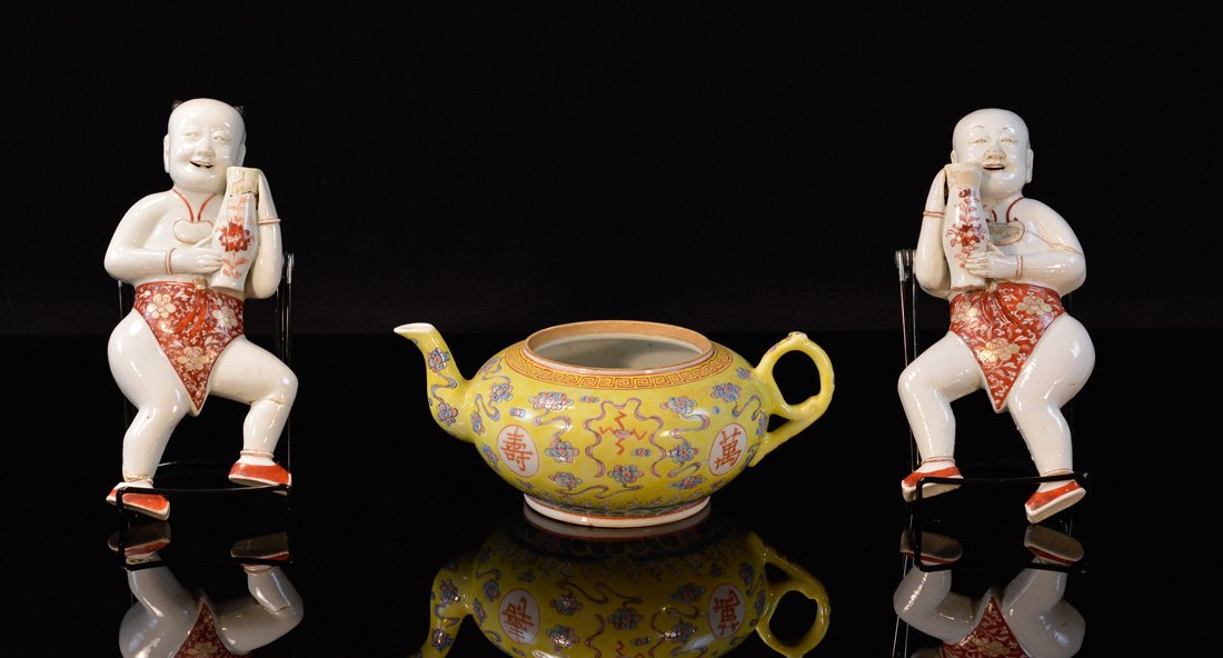 Group of Three Chinese Porcelain Articles - Including: two boy wall vase, kangxi, broke; one famille rose yellow teapot, no cover, measures two at 9"h 4"w, one at 9"h 7"w Provenance: Estate of Alfred Guntermann, New Haven, Ct