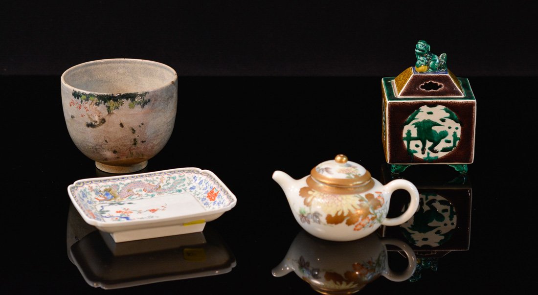 Group of Four Japanese Porcelain Articles: kutani teapot, censer, cup and dish, largest measures 5"h 5.75"w Provenance: Estate of Alfred Guntermann, New Haven, Ct