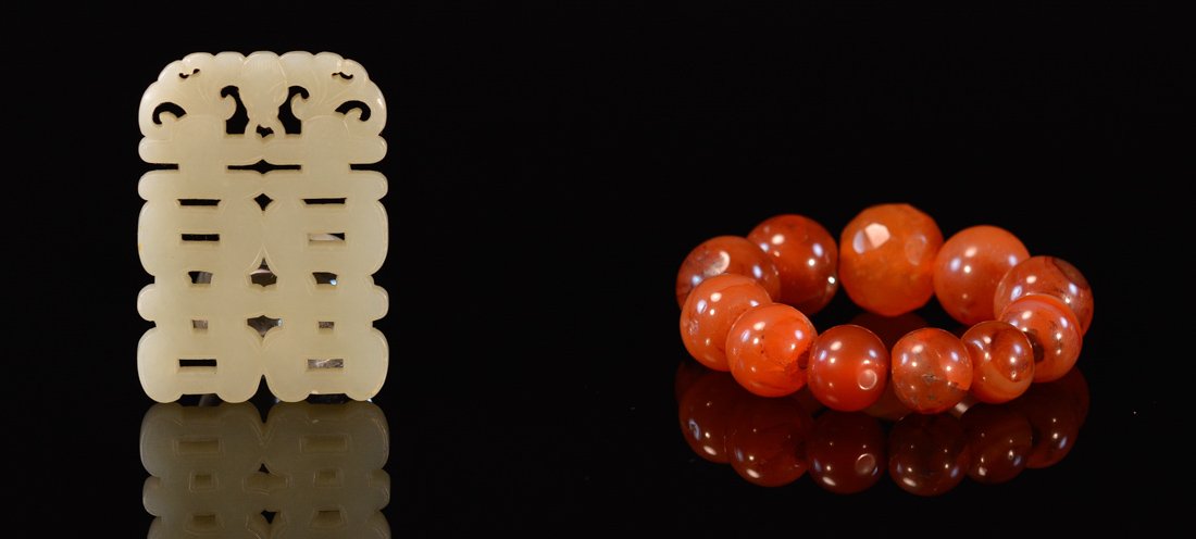 Two Chinese Agate and Jade Pieces: 19th cen, one carnelian bracelet, another jade double happiness plaque, bracelet measures 3"h 2"w, jade measures 2.5"h 1.7"w