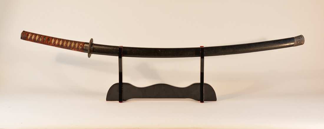 Japanese Sword in Black Lacquer Sheath: blade much older, with iron tsuba, measures 39"l