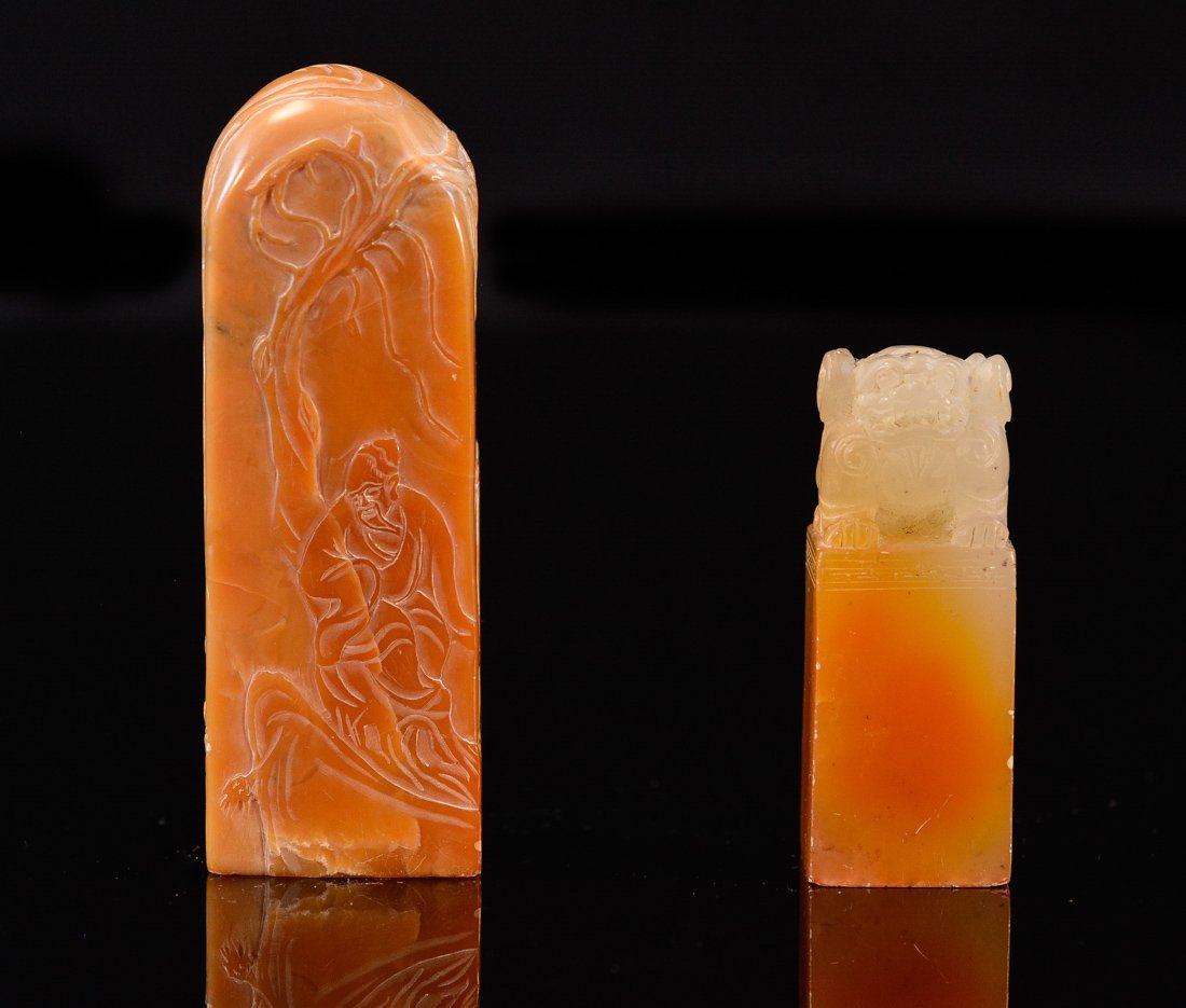 Two Chinese Yellowish Tone Soapstone Seals: 19/20th cen, one with foolion finial, another with scholar scene; one measures 3"h 1"w, the other 2"h .75"w .