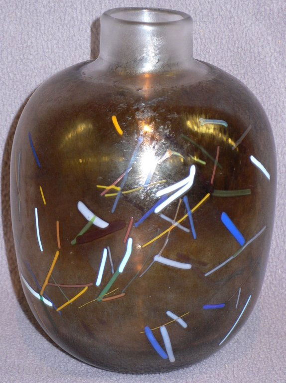 Kosta Boda glass by Bertil Vallien: A rare vase, 1961, by Bertil Vallien for Kosta Boda, by this illustrious Swedish glass artist, the piece is cased, imbedded, iridized and large for its type. 4 1/2 inches wide x 7 inches high.