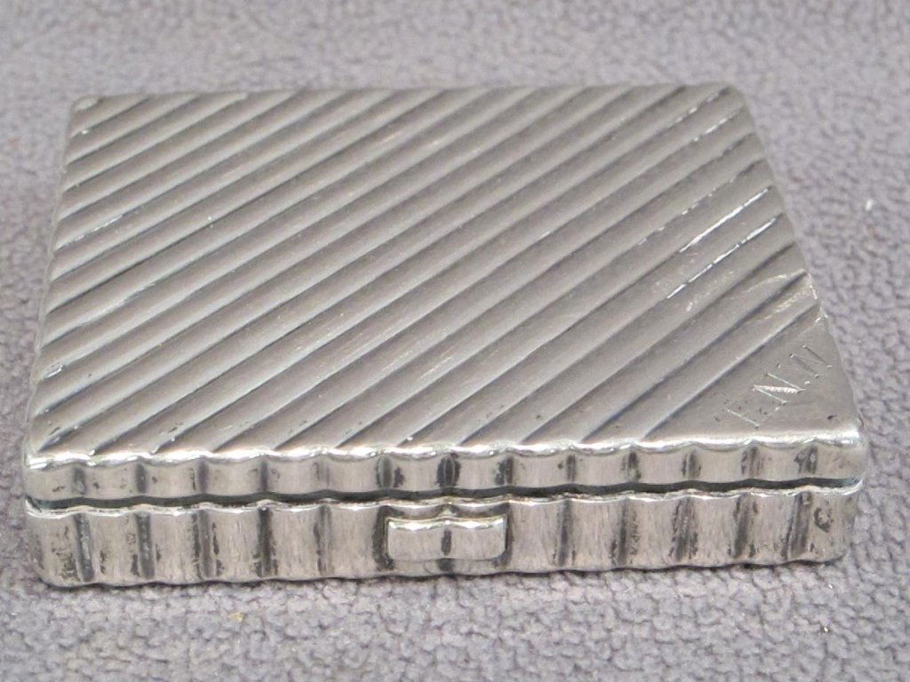 Early 20th C. silver cigarette box: Early 20th C. silver cigarette box, Ex-Edith Wharton, Art Deco period 1925. Marked sterling and by the jewelry maker "Avedon", of bold ribbed , caned design, and engraved ENW (Edith Newbold Wharton).