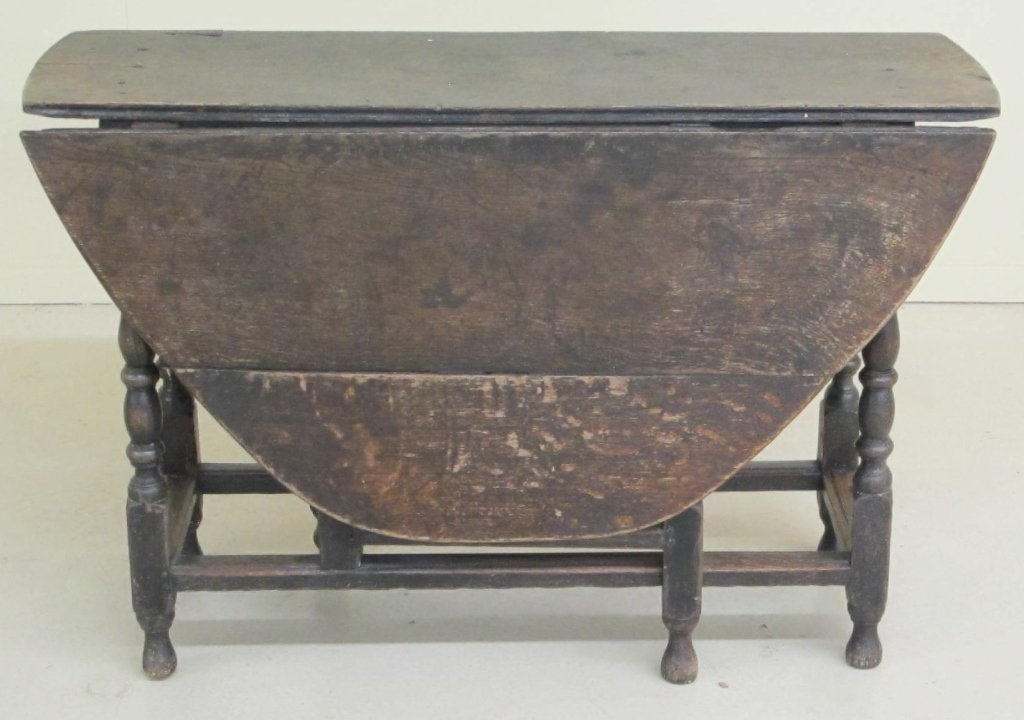 mid 17th century English oak gateleg table: A mid 17th century English oak gateleg table, C. 1670. A nice generous size, the family had the eight English Windsor armchairs offered here, around it. Strong and solid, well turned with old deep col