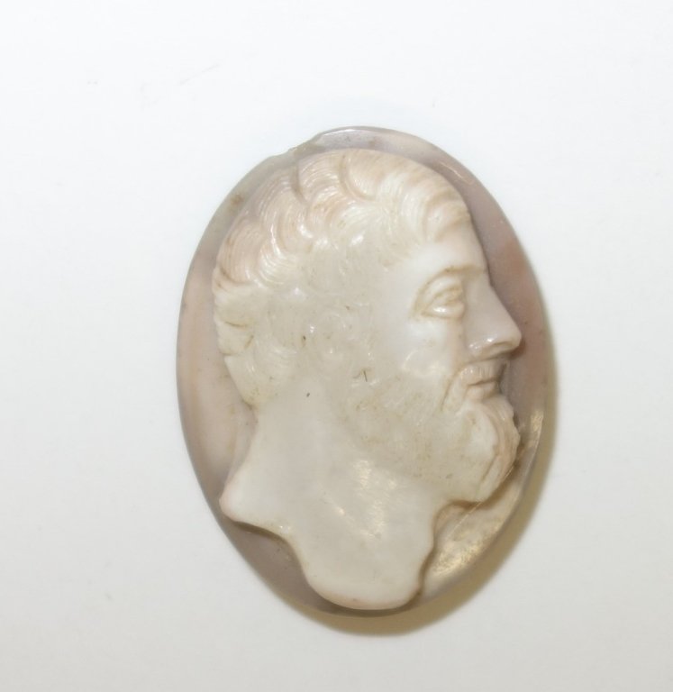 Greco-Roman Gem cameo carving: Ancient, rare and fine Greco-Roman Gem cameo carving. A high relief gemstone carving of two color banded chalcedony. An elder male portrait bust of superb quality and quite surely of high Greek classi