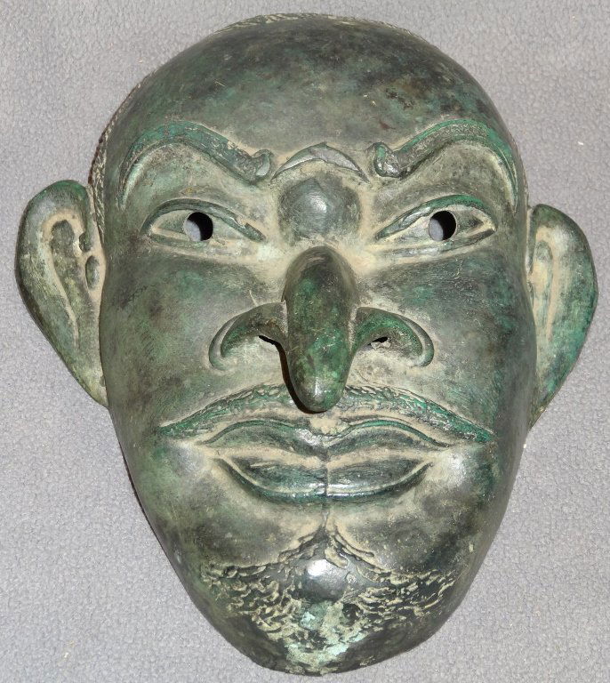 Early cut and chiseled, full size Japanese bronze: An early cut and chiseled, full size Japanese bronze face mask. Thinly cast, hammered and worked. Hooked nose Deity or Folklore representation . Face fitting and wearable, open eyes. True age with min