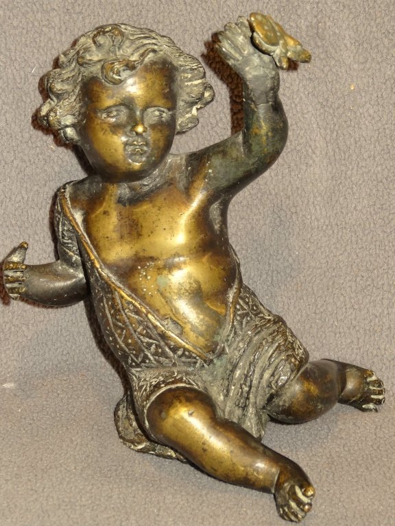 European bronze putti figure: Early European bronze putti figure, Continental, 18th C., probably French. In close manner of Simone Boizot, The seated child with butterfly, it is missing its bronze or stone base. An old crack at it