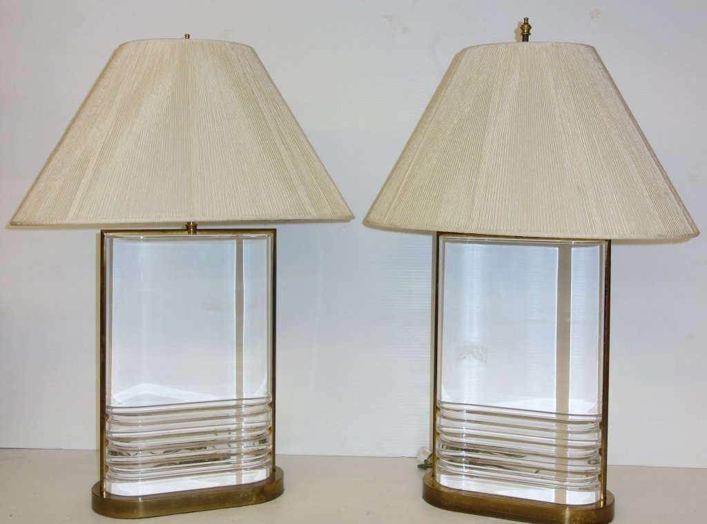 Mid century modern Karl Springer Lucite lamps: Pair of Mid century modern Karl Springer Lucite & brass lamps with original string shades. 28 inches x 12 inches.