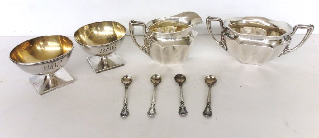 8 pieces sterling items: 8 pieces sterling items including sugar, creamer, cups. Largest measures 4 1/2 inches x 2 1/2 inches.