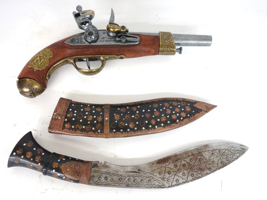 Copy of antique Pistol & Moroccan tourist knife: Copy of antique Pistol & Moroccan tourist knife. Largest measures 12 1/2 inches long.
