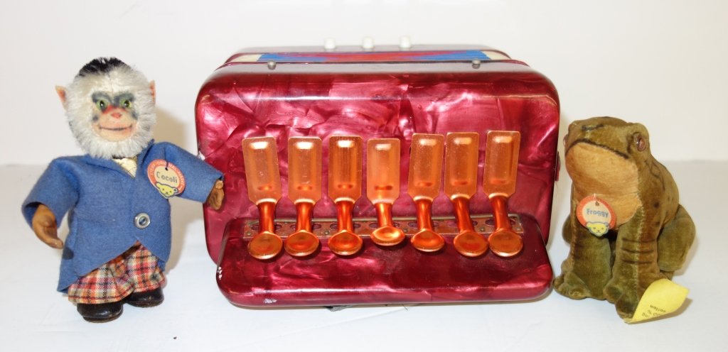 Toy lot 2 Steiff & 1 accordion: 3 piece toy lot including Steiff monkey "Cocoli"; Steiff frog "Froggy" & accordion. inches x 6 1/2 inches.