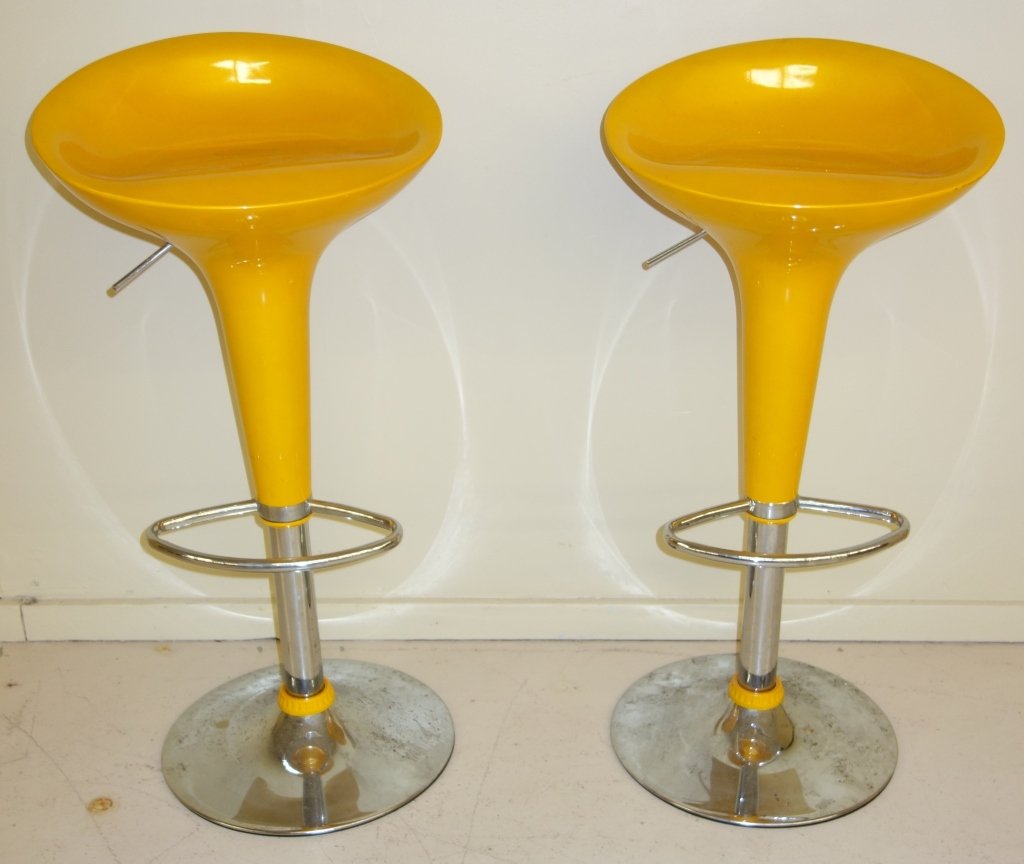 Pair of yellow modern bar stools: Pair of contemporary yellow modern bar stools. 34 1/2 inches x 17 inches.