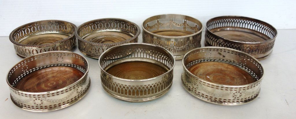 7 piece silver plate Champagne coasters: 7 piece silver plate Champagne coasters. There are 2 matching sets. 5 inches x 2 inches.