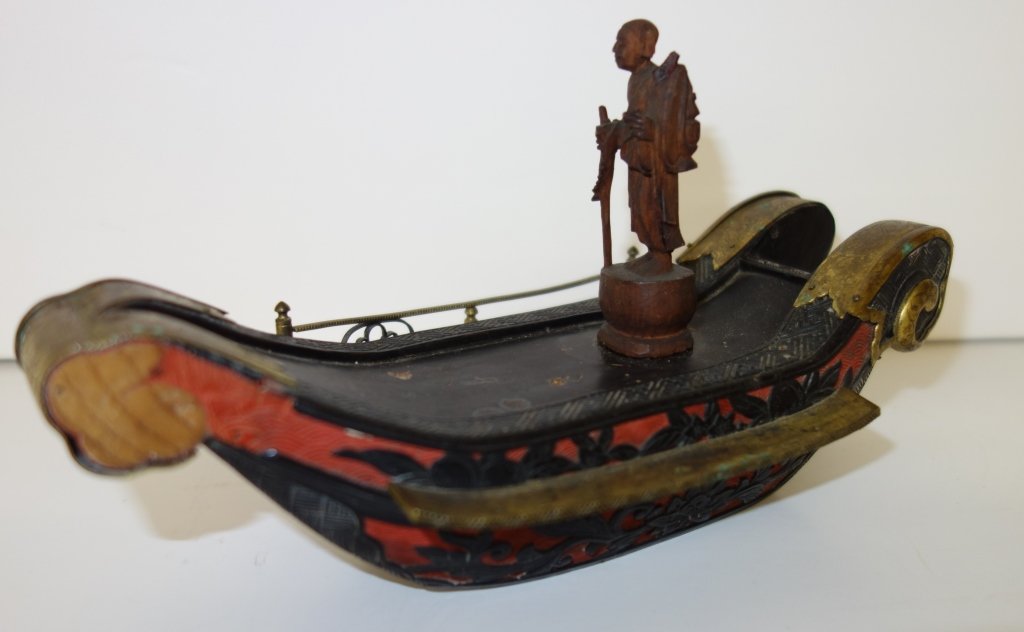 Japanese gilded copper cinnabar & carved figure: an unusual and fine Japanese gilded copper, cinnabar and carved boxwood figure on an imperial barge. Edo period, probably 18th century. Lacking pieces. 7 1/2 inches x 3 1/2 inches.