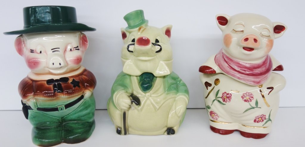 3 pig cookie jars: 3 pig cookie jars. Largest measures 12 inches x 7 inches.