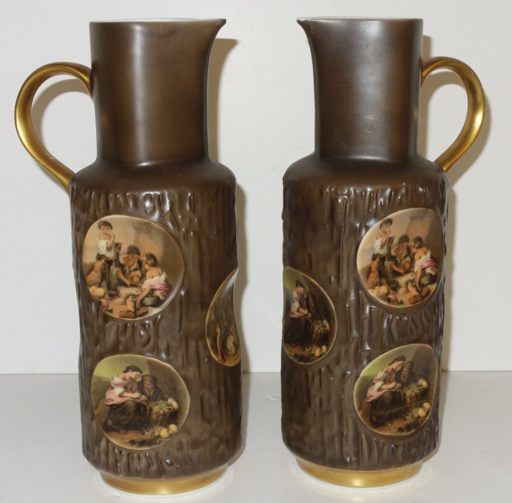 Pair of German jugs: Pair of German vintage decorated porcelain jugs, Vohenstrauss, Bavaria by John Seltmann. Tree and trunk form, each perfect with 6 panels of children decorations with gold gilding. 11 inches high.