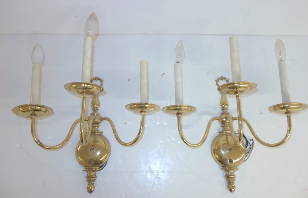 Pair of brass wall sconces: Pair of brass wall sconces. 17 inches x 18 inches.