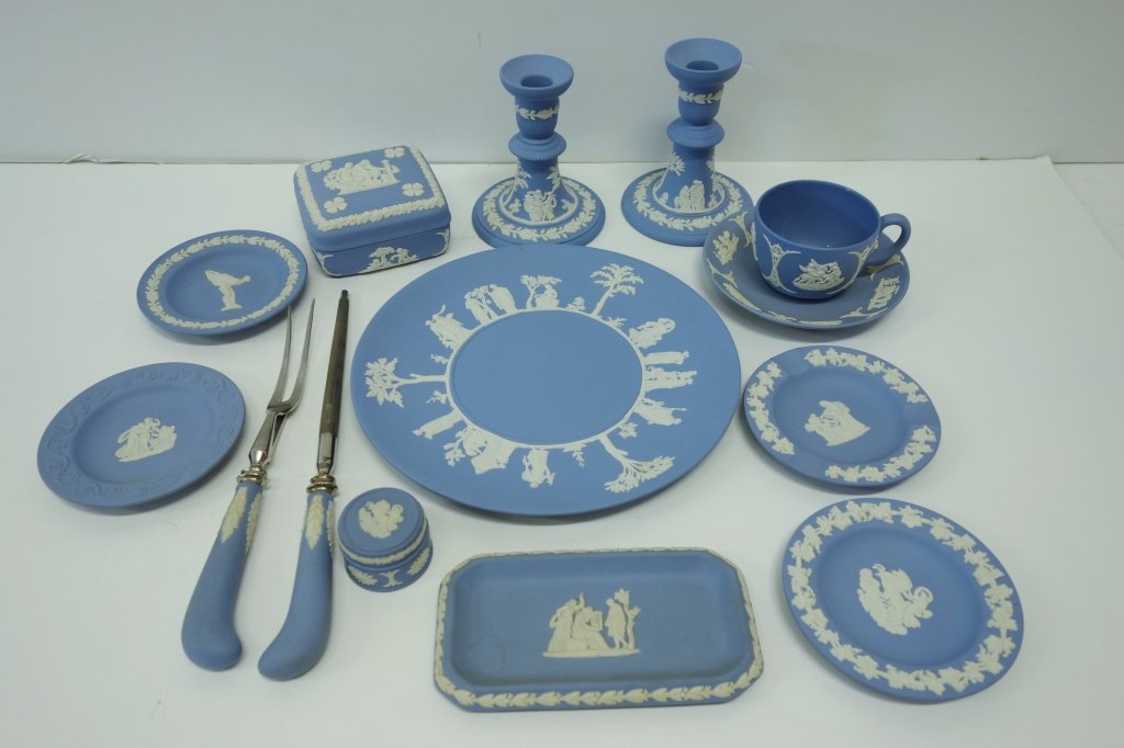 14 piece Wedgwood blue jasperware: 14 piece Wedgwood blue jasperware including candle holders; cups; saucer; knife; plate.