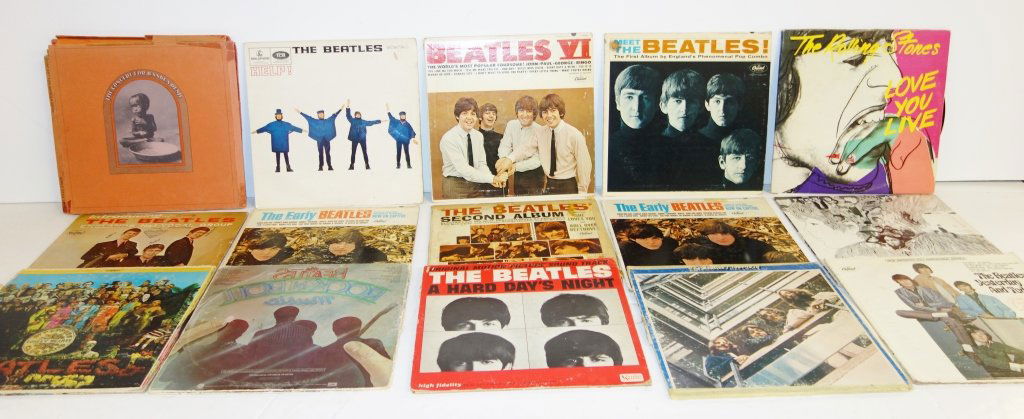 15 rock 'n roll record albums: 15 rock 'n roll record albums including the Beatles & the rolling stones. Ruff condition.