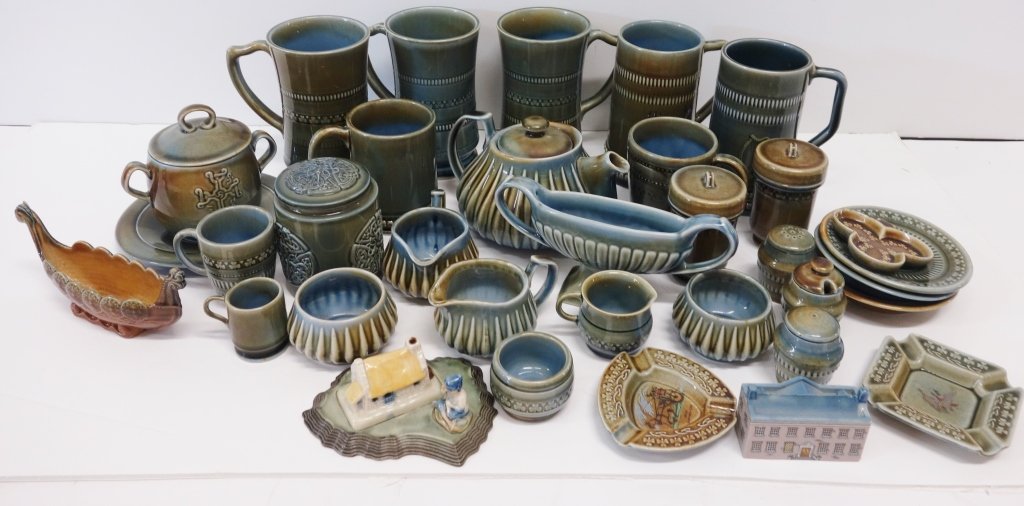 33 pieces of porcelain made in Ireland: 33 pieces of porcelain made in Ireland including cups; mugs; ashtray; sugar; creamer. Largest measures 6 1/2 inches high.