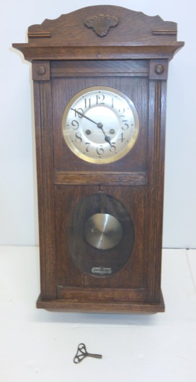 Wall hanging clock: Wall hanging clock with key & pendulum. 29 x 14