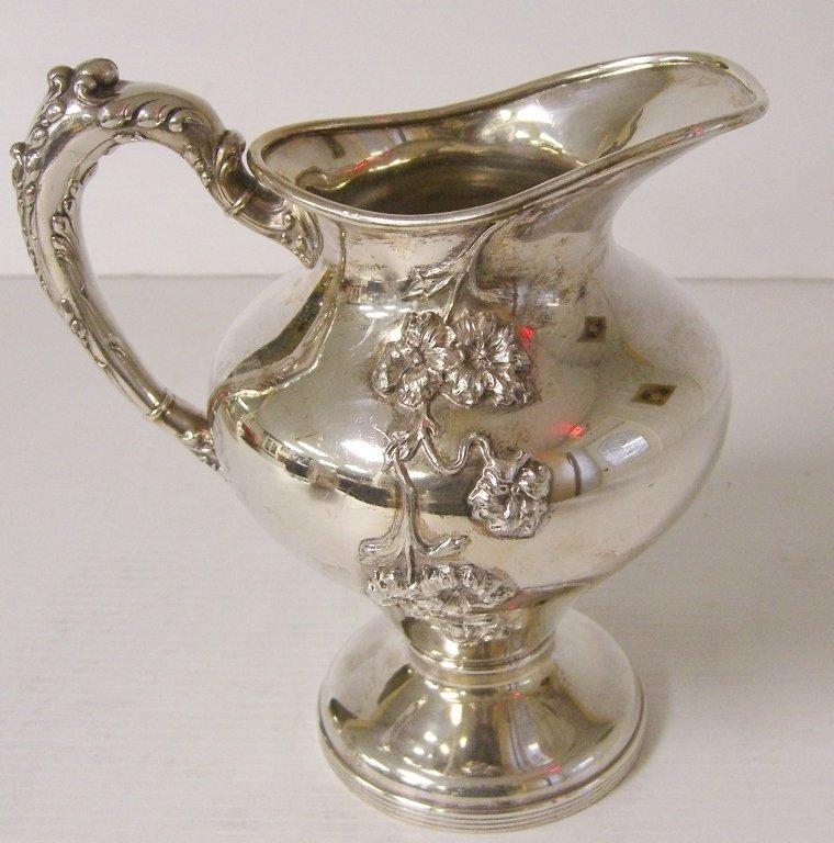 Silver plate ornate repousse water pitcher (1 of 4)