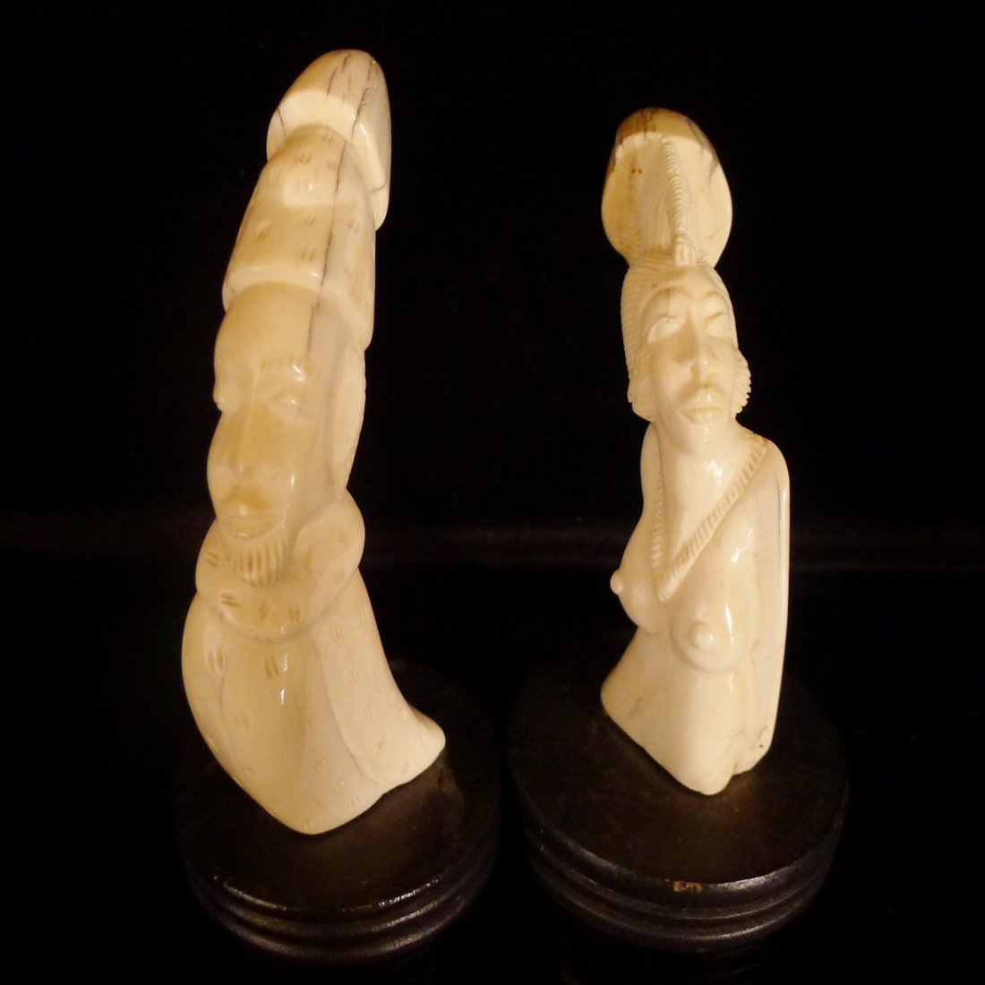 Pair Antique African Carved Ivory Tusks With Stands: 象牙非洲人像A pair of ivory decoration, figure design, 20 cm .longPair Antique African Carved Ivory Tusks With Stands: well polished tusks carved with figure faces,