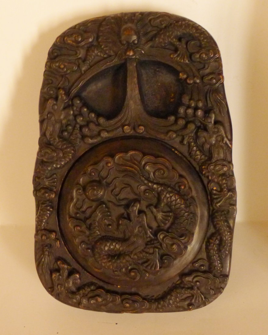 Chinese Antique Carving Inkstone: 中國雕刻硯臺A Chinese Antique Carved Ink Stone: very detailed carved, with the design of dragons in flight amid cloud scrolls, of late Qing Dynasty; Measurement: 23