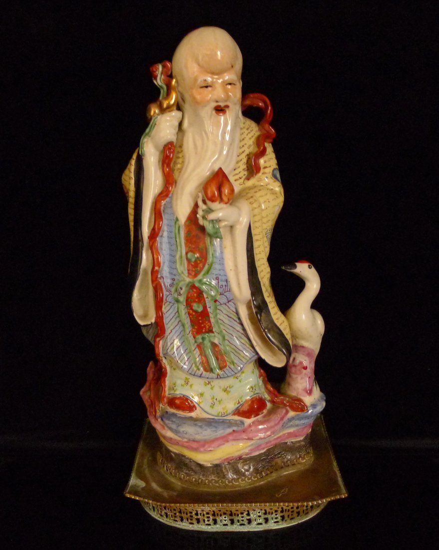 A Chinese Antique Famille Rose Porcelain: 一個中國仿古粉彩陶瓷壽星A Chinese Antique Famille Rose Porcelain Shoulao: signed on the base, of late Qing or Minguo period; Siz