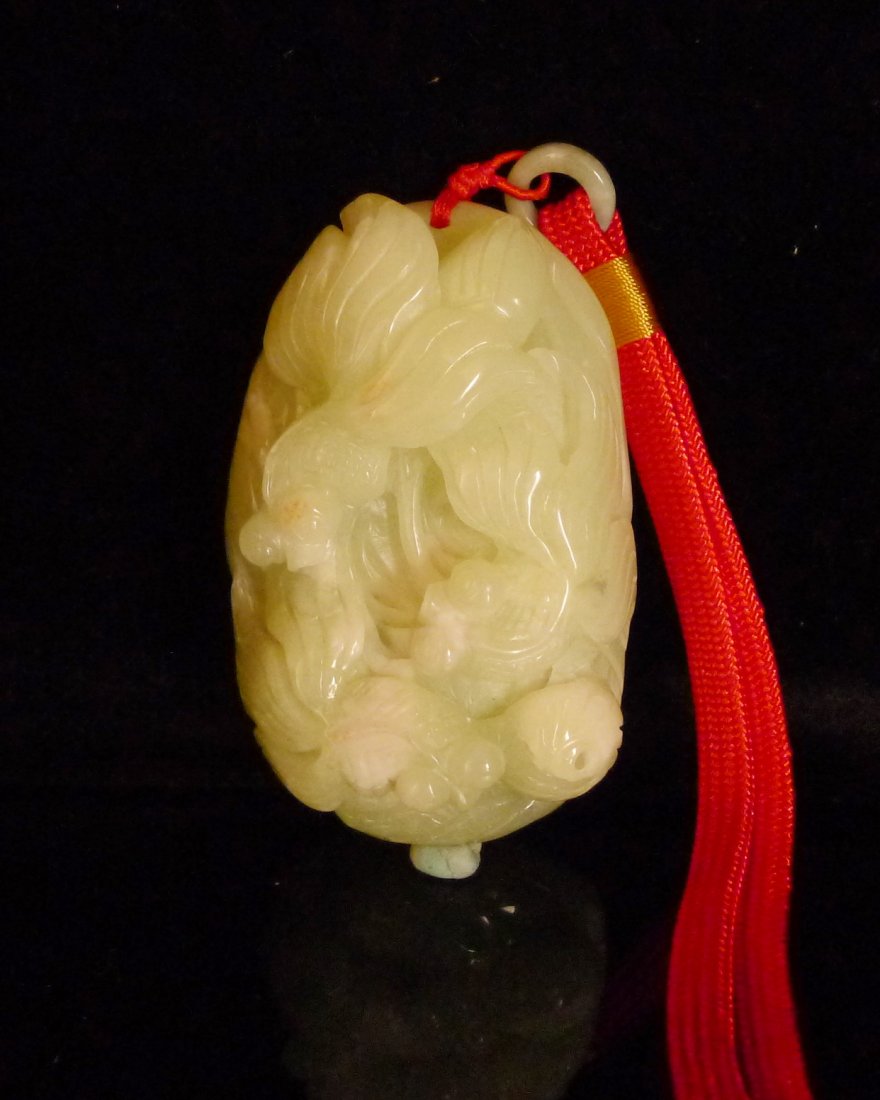 Chinese White Jade Carved Fishs: 中國巧色雕玉挂件Chinese jade carved pendat; featuring fishs; of translucent white tone with mutton fat suffusions; Size: H: 9 cm, W: 6cm,4.5cm . 280 gra