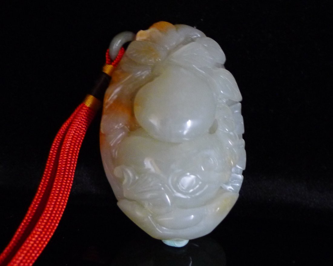 Chinese White Jade Carved Gourd Pendant: 中國巧色雕玉葫蘆挂件 Chinese jade carved pendant; featuring Gourd ; of translucent white tone with mutton fat suffusions; Size: 90mm x 60mm,