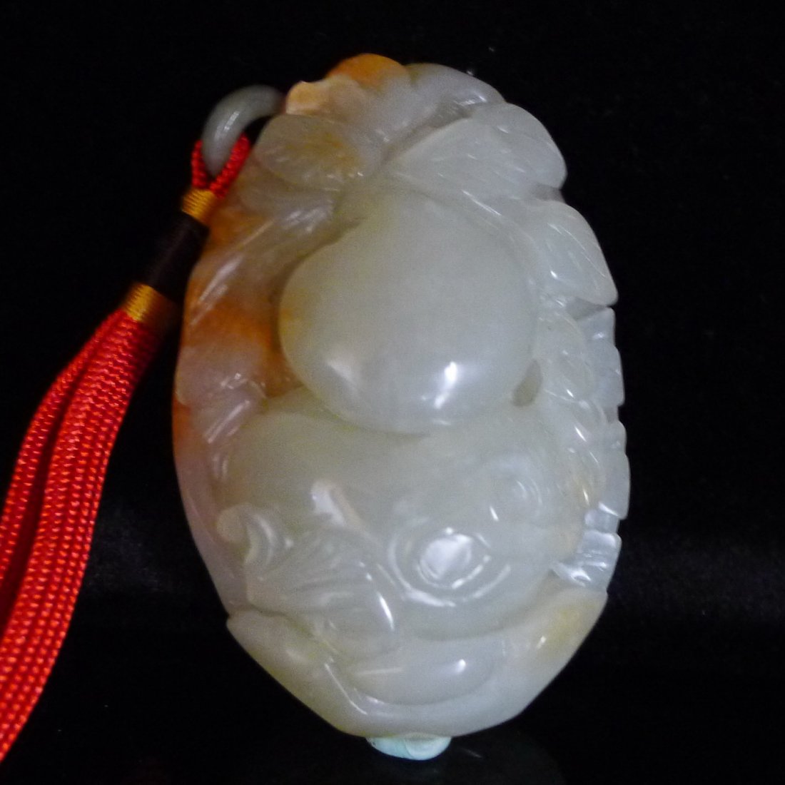 Chinese White Jade Carved Gourd: 中國巧色雕玉葫蘆挂件Chinese jade carved pendant; featuring Gourd ; of translucent white tone with mutton fat suffusions; Size: 9 cm x 6cm,4.