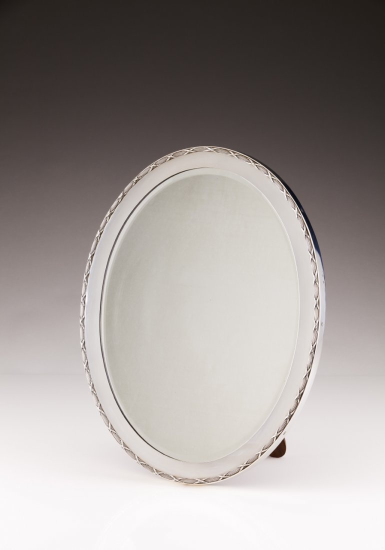 Unusual pair of large late 19th, early 20th century: Unusual pair of large late 19th, early 20th century Portuguese silver table mirrors, Leitão & Irmão Mirrors of oval shape with silver frames decorated in the Louis XVI manner, rosewood back Lisboa a