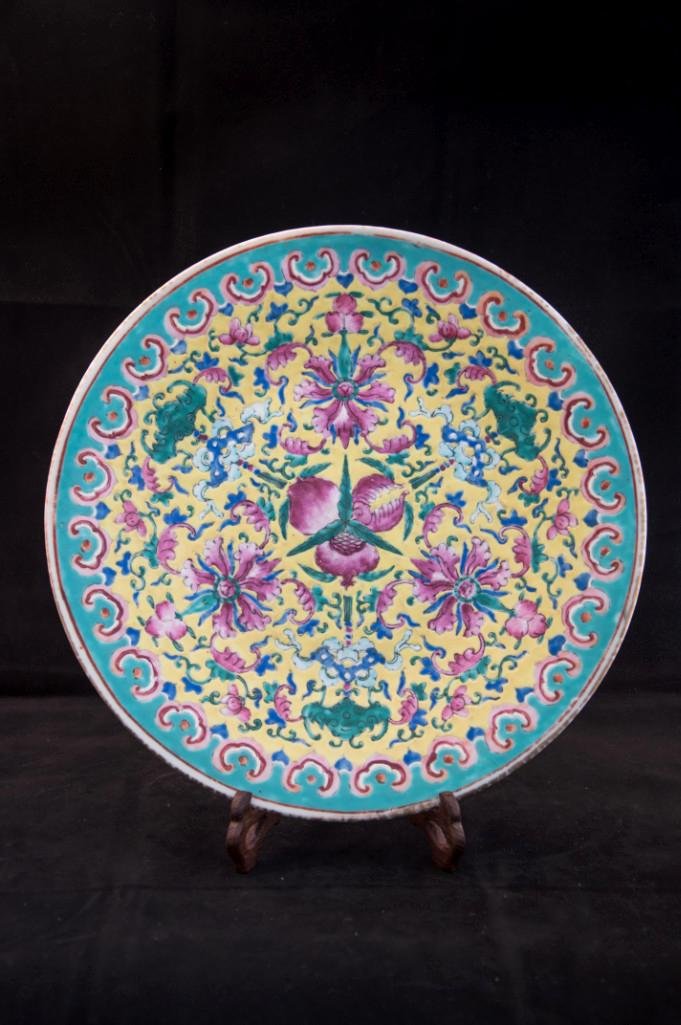 YELLOW GROUND PORCELAIN DISH: With slightly deep well by turquoise green glaze on inner rim supported by a everted foot the well and interior sides enameled in elaborate lotus and vine motifs with three bats and three lotus flower