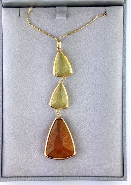 Lalique Ice Light Amber Necklace: NECKLACE 3 EL ICE LIGHT AMBER POThis pendant, two small yellow crystals and one large amber crystal, comes with a sterling silver 17 1/2″ Ã± 21 1/2″ adjustable chain.Combining elegance a