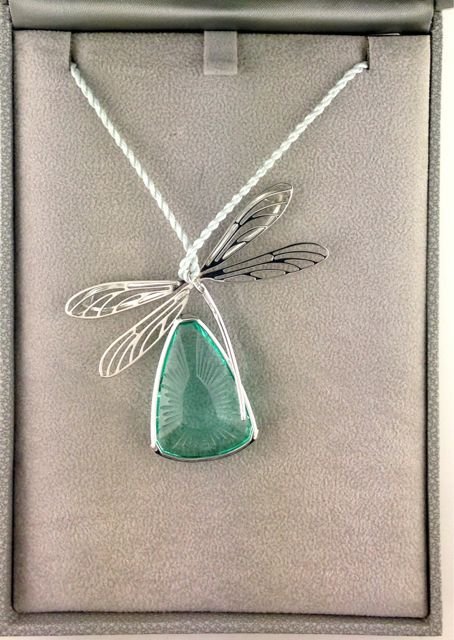 PENDANT: PEND ICE LIGHT LIB LAGON AGThis pendant, with a sterling silver bale, comes with a grey Lalique cord.Combining strength and softness, the Ice Light Libellule jewels take us to purity and poetry. The w